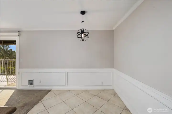 Dining Area: Dining area with modern pendant lighting and tiled flooring, perfectly placed between the kitchen and living room. The open design offers an easy flow for meals, entertaining, or working from home.