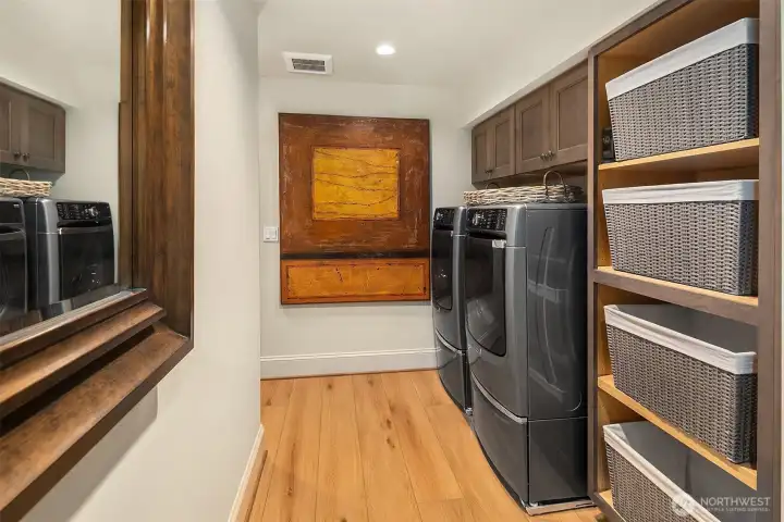 Laundry area with ample storage for extra downstairs linens and towels