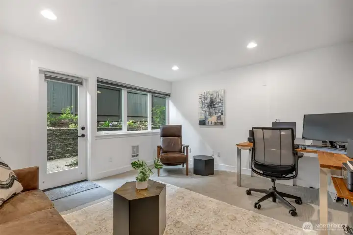 Family room on ground level opens to a patio