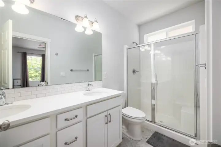 Main floor primary bath with oversized walk-in shower