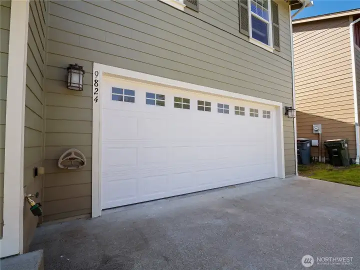 The attached two car garage features a brand-new garage door, adding both convenience and curb appeal.