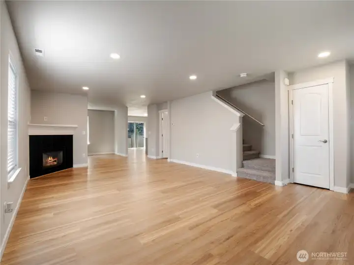 Designed for easy living and entertaining, the living room flows into a flex space, half bath and the kitchen/dining area for a cohesive main floor experience.