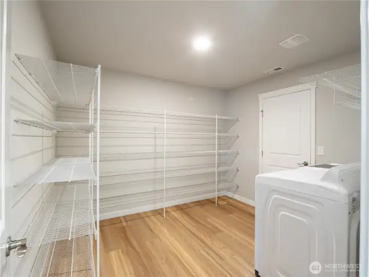 This oversized pantry offers abundant storage, keeping your kitchen organized and clutter-free.