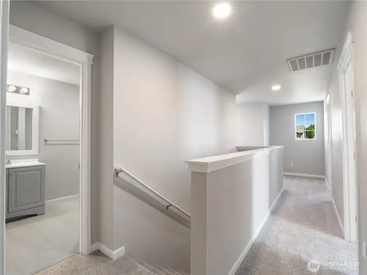 A remodeled full-size bathroom awaits upstairs, showcasing a clean and modern refresh.