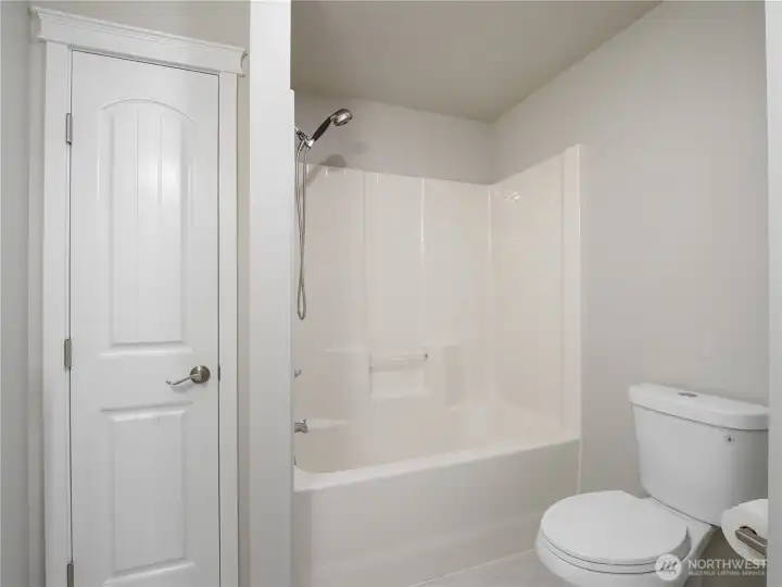 Serving the three bedrooms across the hall, this full-size bathroom offers easy access.