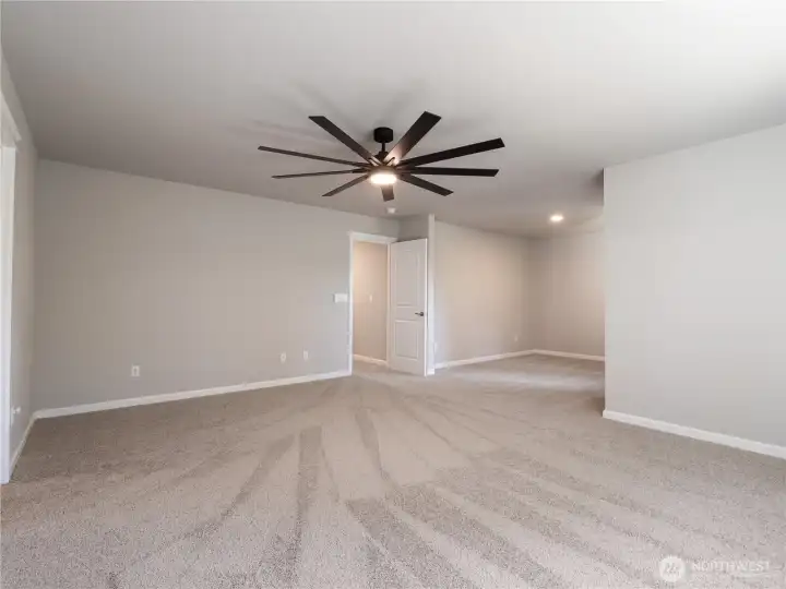 Step into your massive primary suite, complete with a newly installed ceiling fan for year-round comfort.