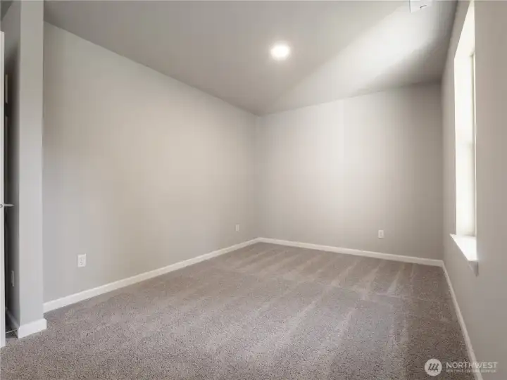 The primary suite offers extra space that can serve as a flexible area to fit your lifestyle needs.