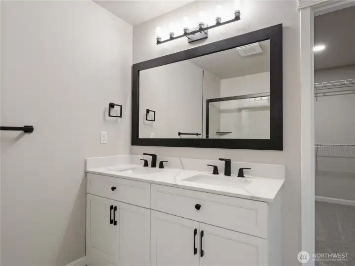 Enjoy a beautifully newly remodeled primary bathroom complete with a double sink vanity and modern finishes.