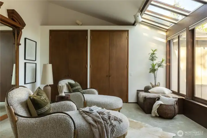 Sitting area of Primary Suite with views of open-air atrium