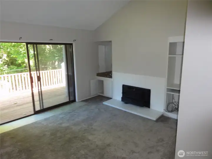 Living room complete with fireplace and wet bar! Slider to nice deck and territorial view.