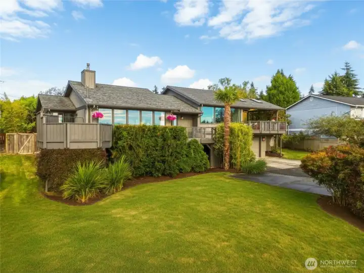 Beautifully updated Whidbey Island home with panoramic Puget Sound views, private community beach access, and west-facing decks overlooking Double Bluff, Useless Bay, and the Olympic Mountains.