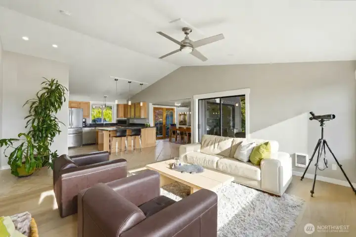 Great room with kitchen and dining area accessible to outdoor living space and back yard access