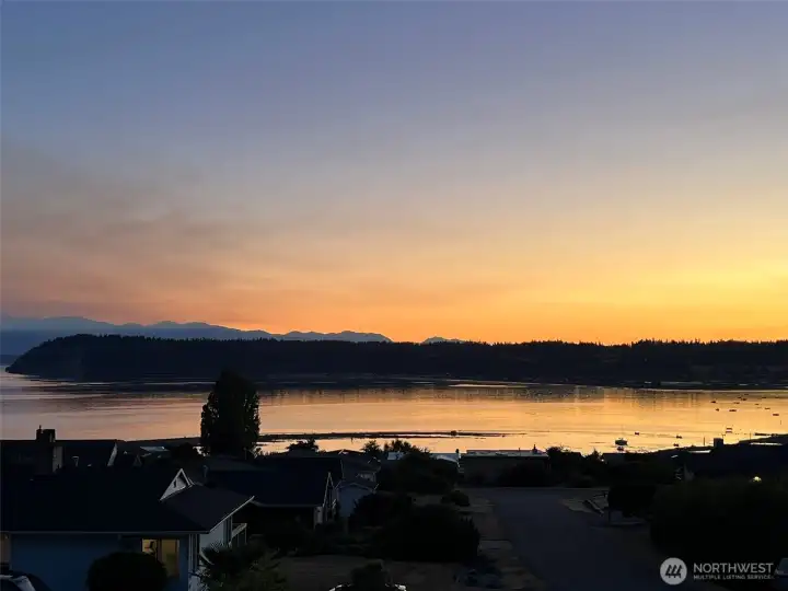 Sunset view across Useless Bay, Double Bluff, Puget Sound and Olympic Mountains
