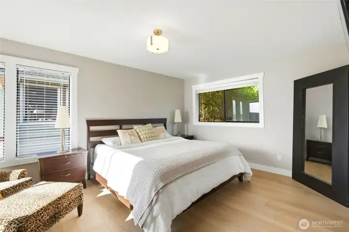 Primary bedroom with sliding glass door access to hot tub deck