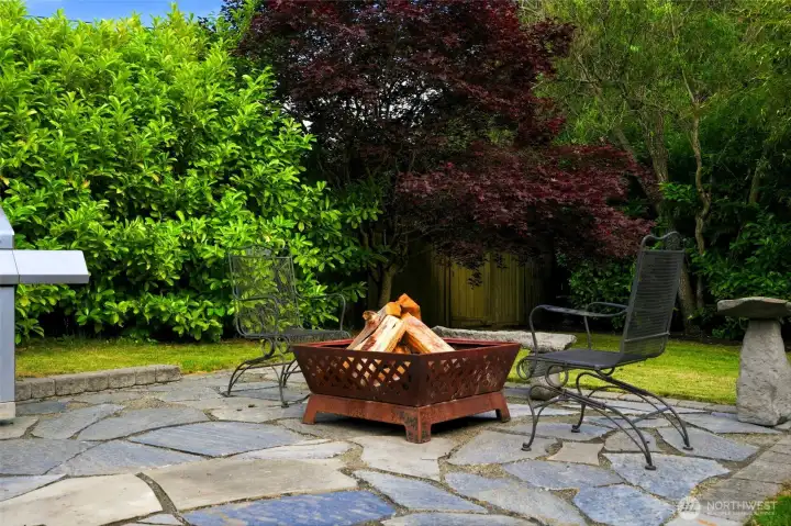 Private backyard patio with firepit