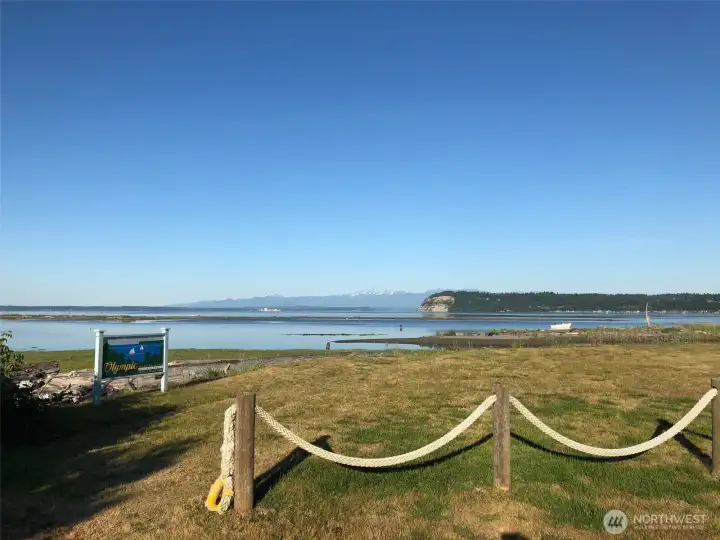 Private community beach with designated parking and picnic area