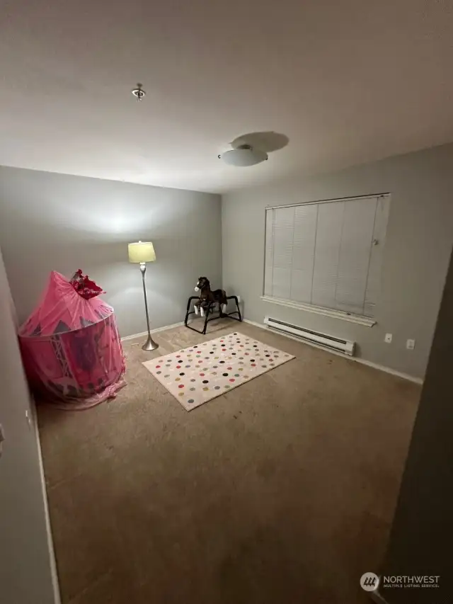 Bedroom on 1st level behind the garage