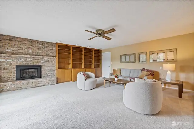 Second living room could be your designated TV room or sitting area, with built-ins and a gas fireplace.