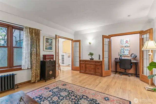 Double hung windows and beautiful leaded glass French Doors.
