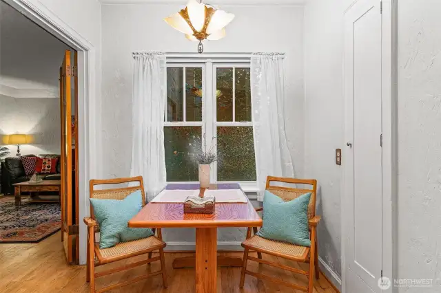 Dining Area with outflow fan and Art Deco light fixtures.