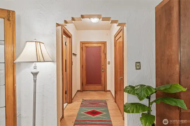 Hallway to bathroom and walk-closet and front door.