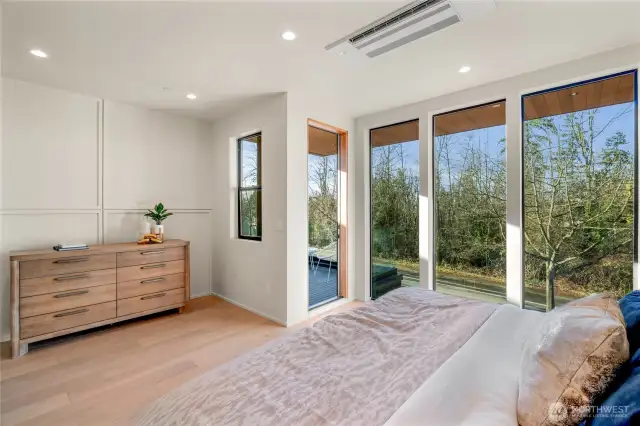 Floor to ceiling windows in primary bedroom