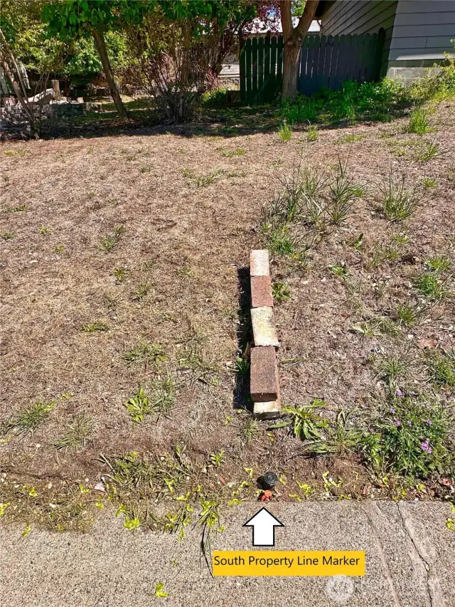 Red pin at sidewalk depicts South lot line