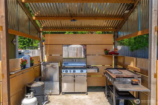 Grilling station includes the smoker, grill, flat grill, and has solar lights