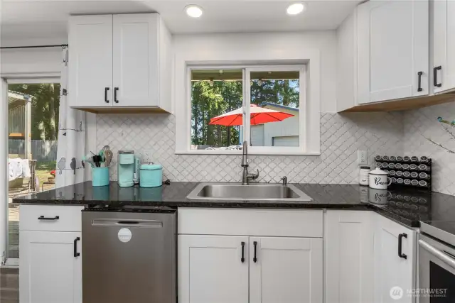 Easy access to the deck and dining is to the left of the kitchen