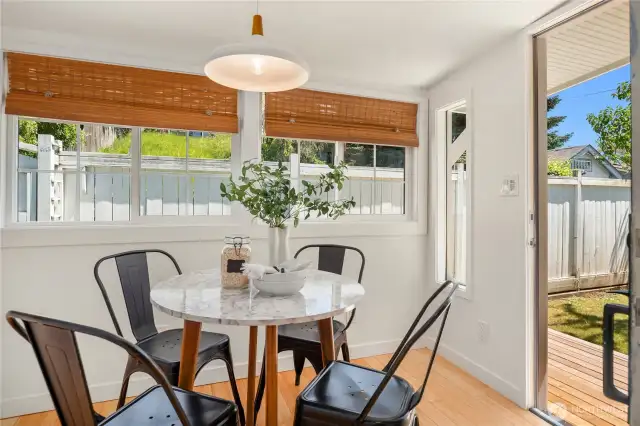 The back dining room opens up to a new cedar barbecue deck.