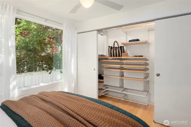 The spacious closet features these convenient and stylish built-ins.