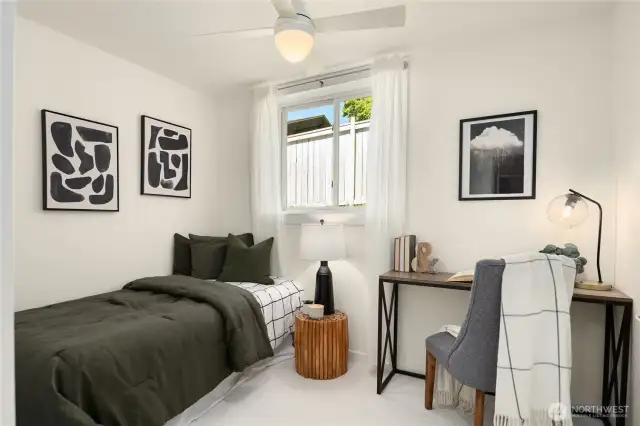 The third bedroom located downstairs also boasts a daylight window and new carpeting.