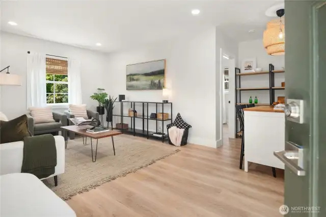 The DADU opens up to a spacious great room with tall ceilings and LVP flooring.