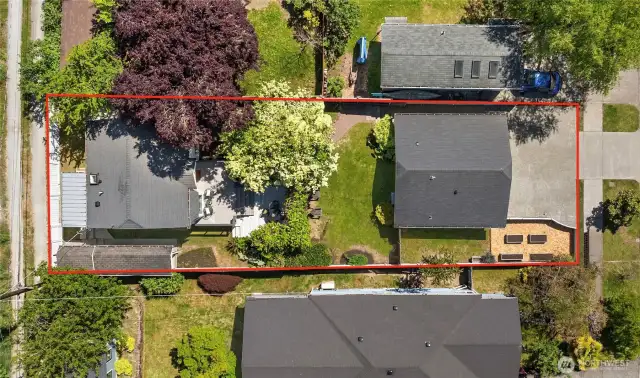 The back house lives privately with it's own fenced yard and the front DADU has a nice sized fenced side yard with a grass area and raised garden beds.