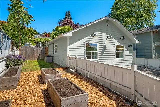 The DADU features its own fenced side yard with raised garden beds and plenty of sunshine to grow whatever you like.