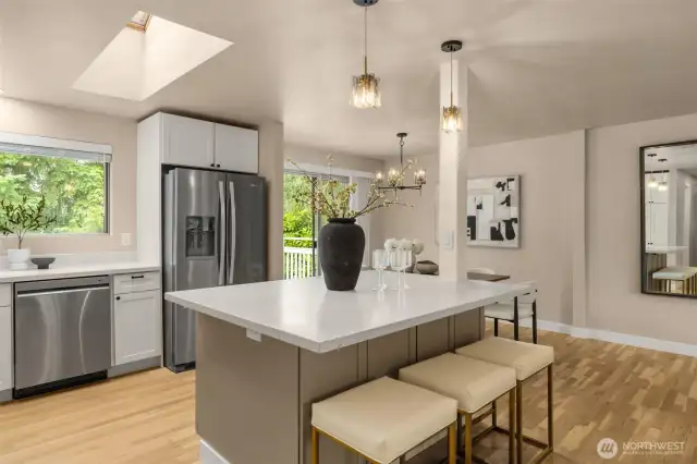 Kitchen island with quartz countertops and seating space
