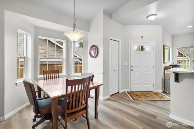 Dining room area with bright natural light. Coat closet next to the front door
