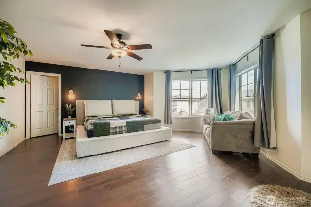 Large primary bedroom with expansive walk in closet