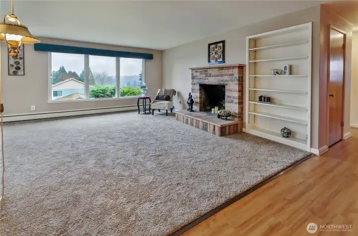 Wood burning fireplace and convenient built-in shelves