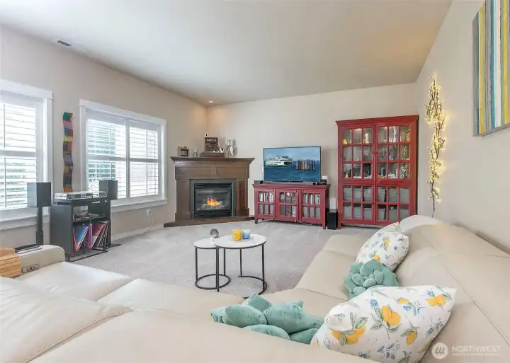 Custom plantation shutters add elegance and elevate the great room.