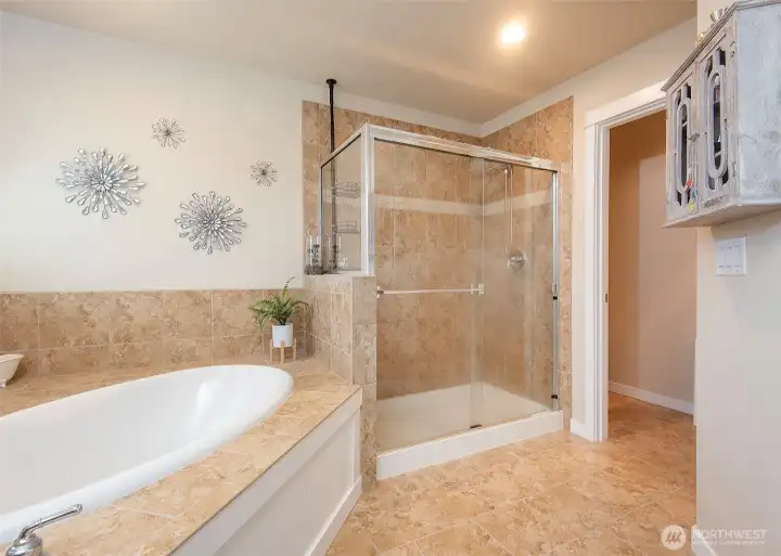 Primary suite with a water closet and walk in closet.