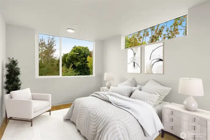 A peaceful sanctuary featuring large windows that invite the outdoors in, creating a calm and restful atmosphere