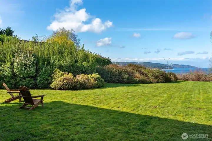 Expansive lawn ideal for outdoor entertaining, recreation, or enjoying the scenic surroundings.