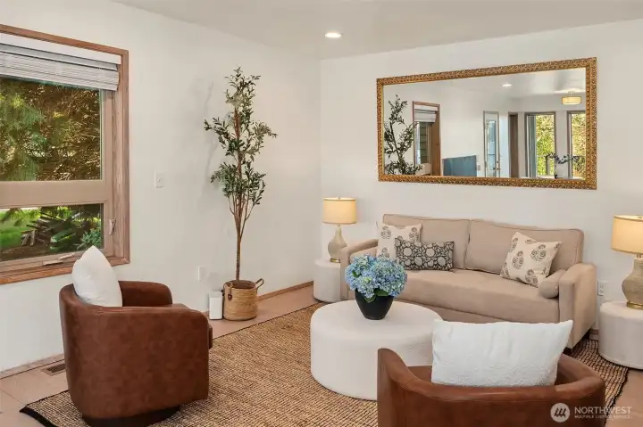 Bright living room with comfortable layout, natural light, and tasteful finishes.