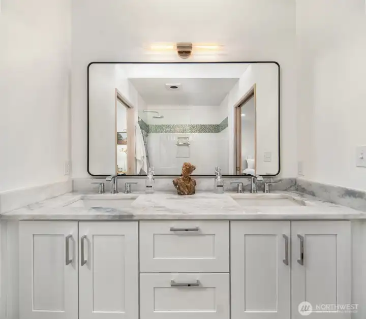 Stylish bathroom vanity with dual sinks, sleek cabinetry, and contemporary design.