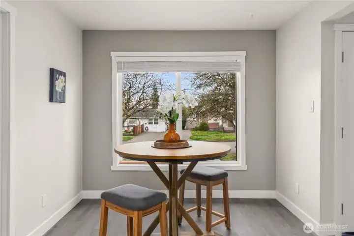 View from kitchen into dining area with view of neighborhood