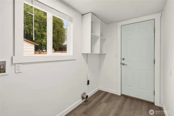 Utility room with door to backyard