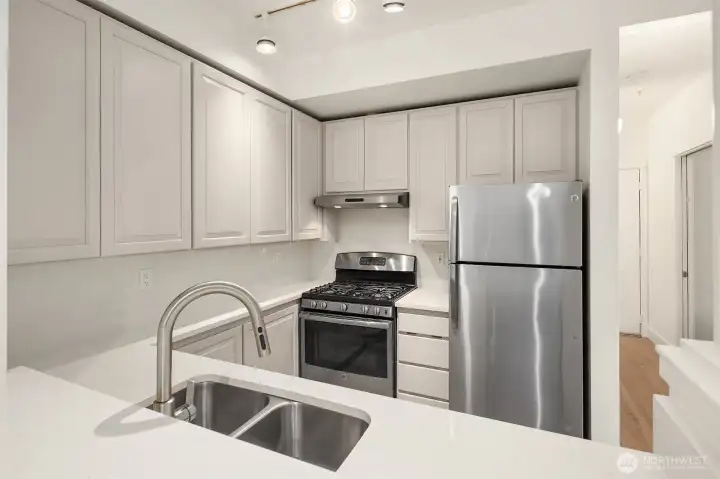 Updated kitchen with solid surface countertops
