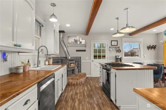 Updated eat-in kitchen with woodburning fireplace.