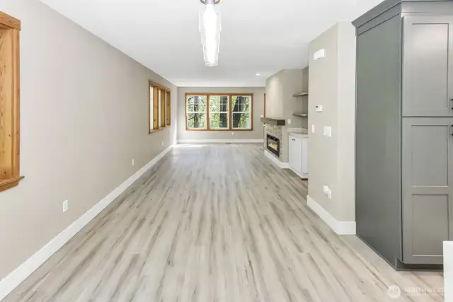 Main floor living area with electric fireplace.